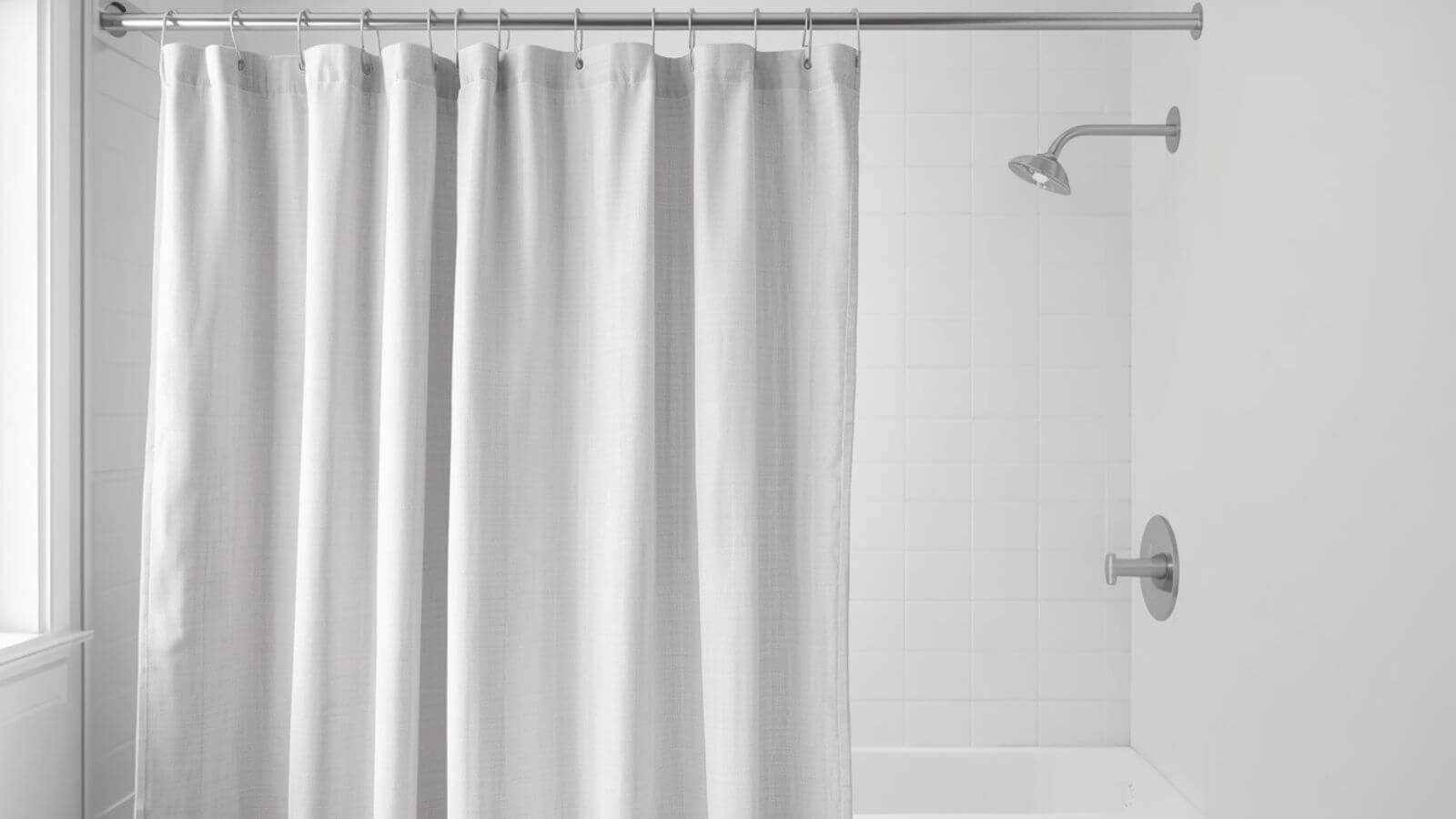 Standard 70 x 72 inch shower curtain hanging above a bathtub